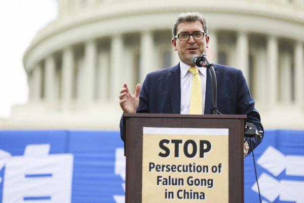Benedict Rogers, British human rights activist and East Asia Team Leader at nonprofit Christian Solidarity Worldwide, speaks at a rally commemorating the 20th anniversary of the persecution of Falun Gong in China on the West Lawn of Capitol Hill in Washington on Jul. 18, 2019. (Samira Bouaou/The Epoch Times)