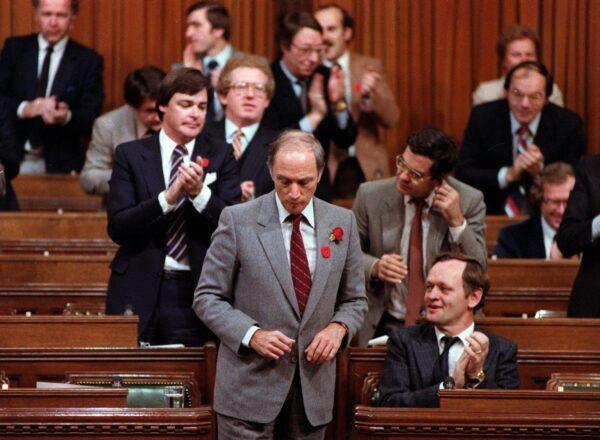 Prime Minister Pierre Trudeau gets a round of applause from Liberal MPs in the House of Commons after signing an accord with the provincial premiers during constitutional talks, in Ottawa on Nov. 5, 1981. (CP Photo/Fred Chartrand)