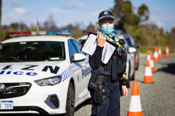 WA Police inspect cars at a Border Check Point on Indian Ocean Drive north of Perth, Australia on Jun. 29, 2021. (Matt Jelonek/Getty Images)