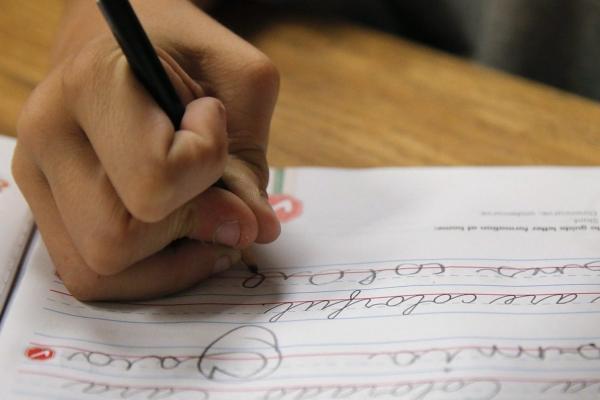 A student practices writing in cursive at St. Mark’s Lutheran School in Hacienda Heights, Calif., Oct. 18, 2012. (The Canadian Press/AP-Jae C. Hong)