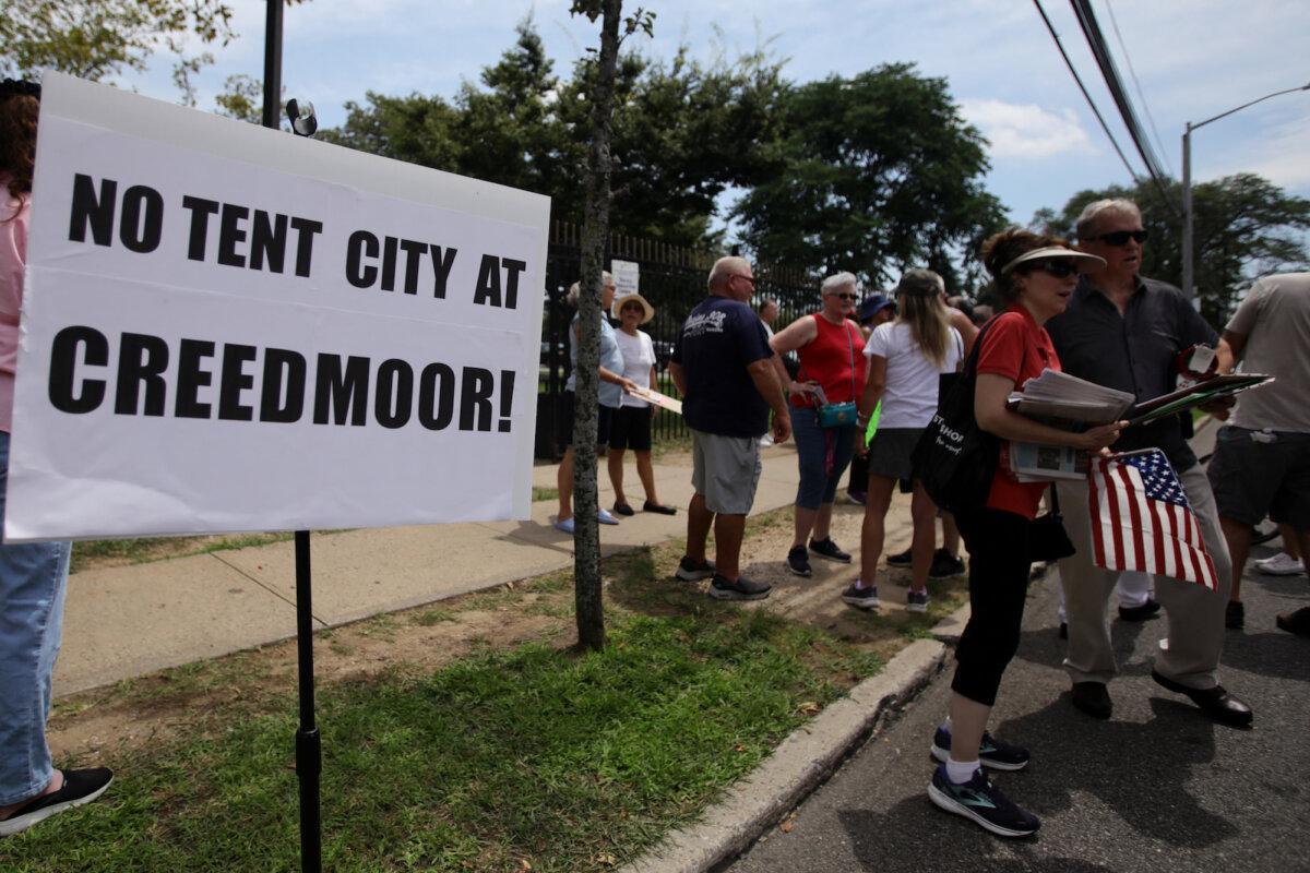 Protesters rally in opposition to the proposed asylum seeker tent shelter on the campus of the state-owned Creedmoor Psychiatric Center in Queens, New York City on July 29, 2023. (Leonardo Munoz/AFP via Getty Images)