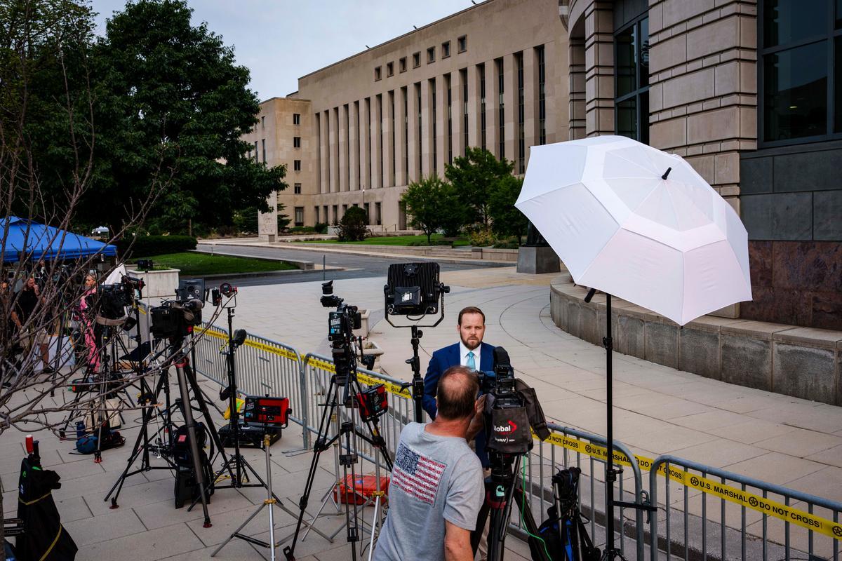 Members of the press wait outside the E. Barrett Prettyman United States Courthouse before former President Donald Trump's arrival for an arraignment, in Washington on Aug. 3, 2023. (Drew Angerer/Getty Images)