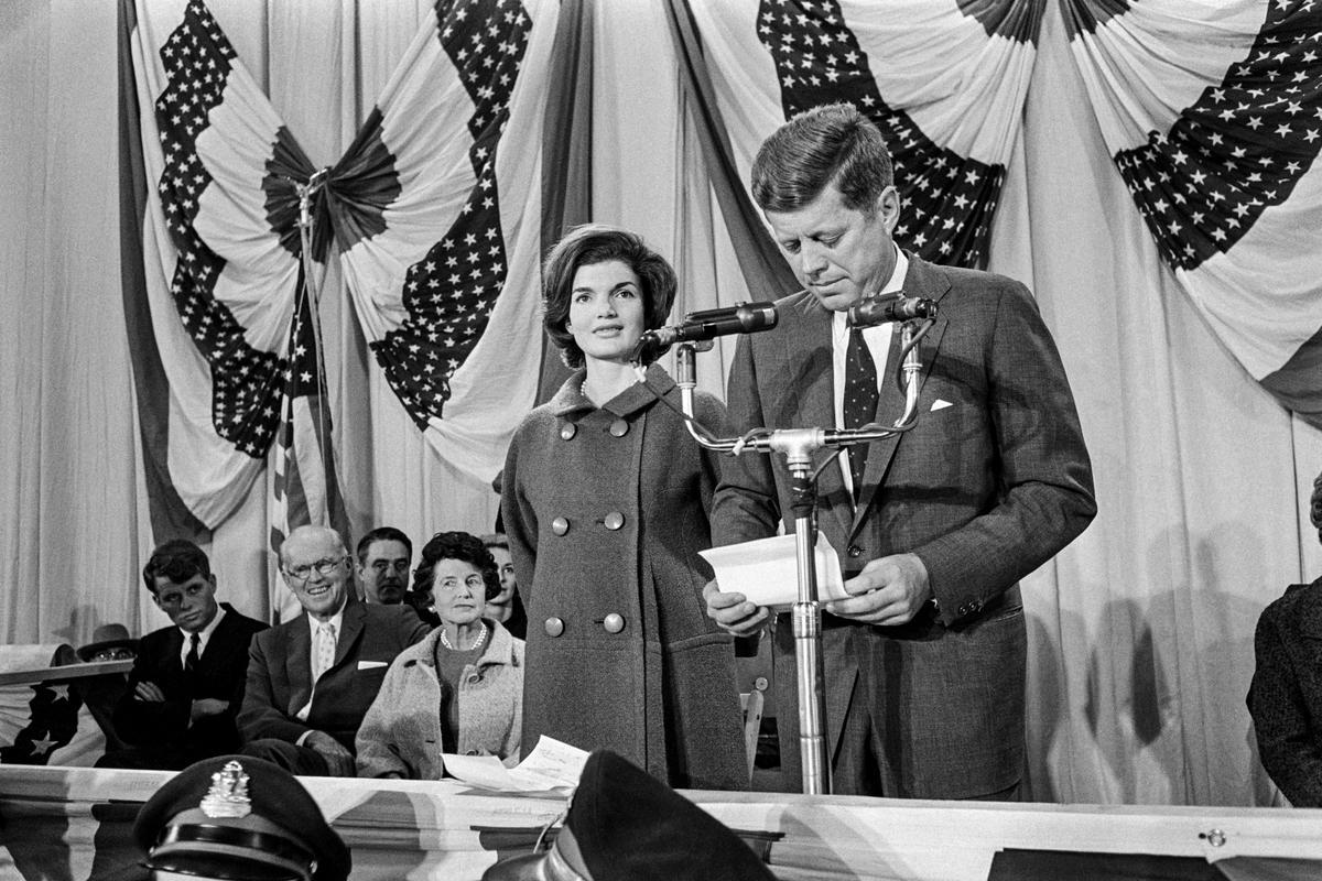 President-elect John Fitzgerald Kennedy (R), alongside his wife, Jacqueline Kennedy, delivers his victory speech at the National Guard Armory in Hyannis Port, Mass., on Nov. 9, 1960. (-/AFP via Getty Images)