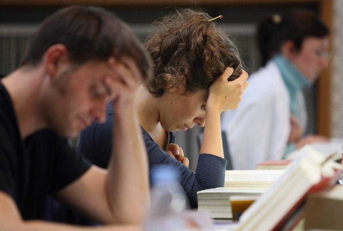 Students study legal texts in the law faculty library at Humboldt University in Berlin, Germany, on Oct. 11, 2011. (Adam Berry/Getty Images)