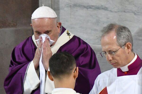 Pope Francis blows his nose as he leads the Ash Wednesday mass which opens Lent, the forty-day period of abstinence and deprivation for Christians before Holy Week and Easter at the Santa Sabina church in Rome on Feb. 26, 2020. (Alberto Pizzoli/AFP via Getty Images)