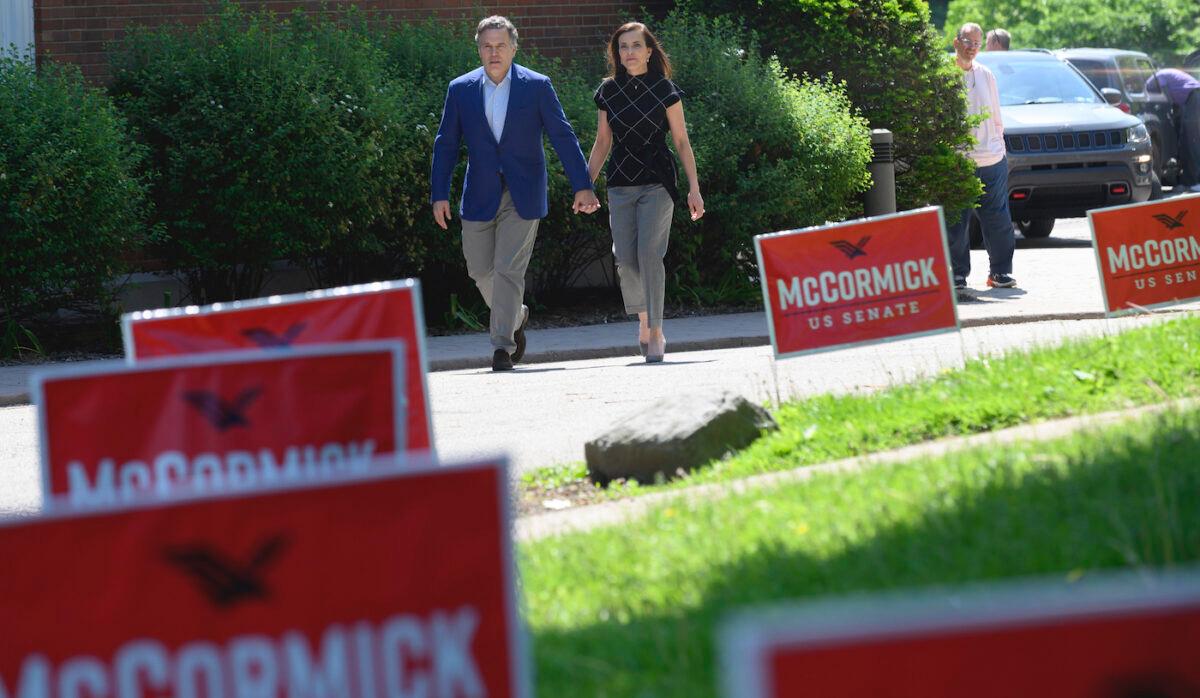  Republican Senatorial Candidate David McCormick and his wife, Dina Powell McCormick, head to vote at a polling location on the campus of Chatham University in Pittsburgh, Pa., on May 17, 2022. (Jeff Swensen/Getty Images)