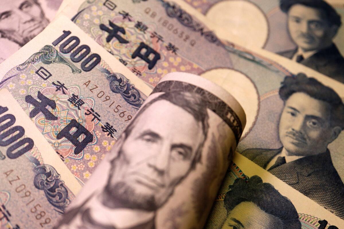 Japanese yen and U.S. dollar banknotes in an illustration taken on June 15, 2022. (Florence Lo/Reuters)