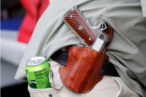  A demonstrator wears a gun on his belt during a rally supporting the 2nd Amendment to the United States Constitution in Fowlerville, Mich., on May 15, 2021. (Jeff Kowalsky/AFP via Getty Images)