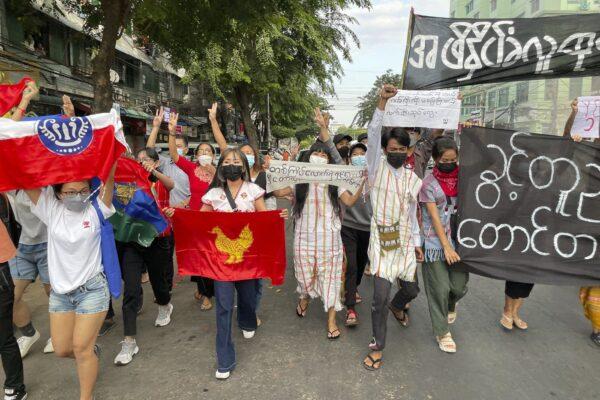 Pro-democracy protesters hold a flash mob rally to protest against Myanmar's military-installed government, at Kyauktada township in Yangon, Myanmar, on Dec. 20, 2021. (The Canadian Press/AP div)