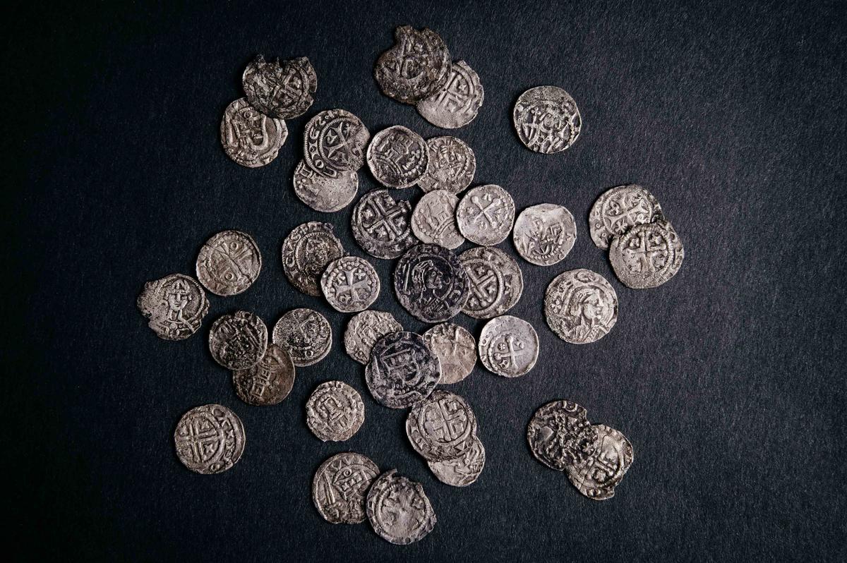  Silver coins, part of the 1,000-year-old medieval treasure discovered in Hoogwoud, Netherlands, are shown in this undated picture. (Archeologie West-Friesland/Handout via REUTERS)