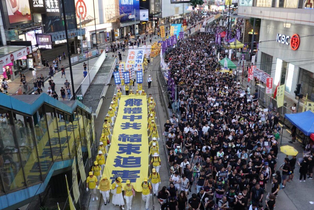 A message reads "End CCP" on a parade banner in Hong Kong on July 1, 2019. (Sung Pi-Lung/The Epoch Times)