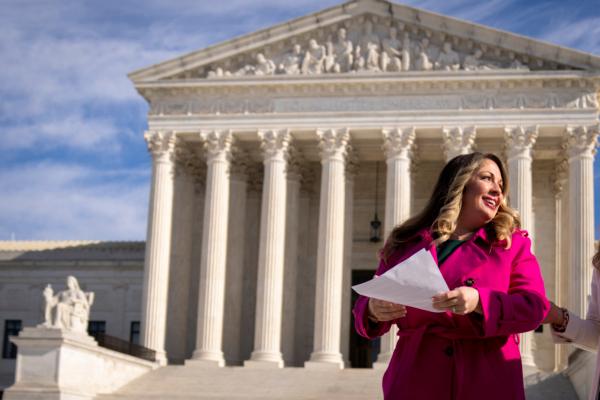  Lorie Smith, a Christian graphic artist and website designer in Colorado, prepares to speak to supporters outside the Supreme Court in Washington on Dec. 5, 2022. (Andrew Harnik/AP Photo)