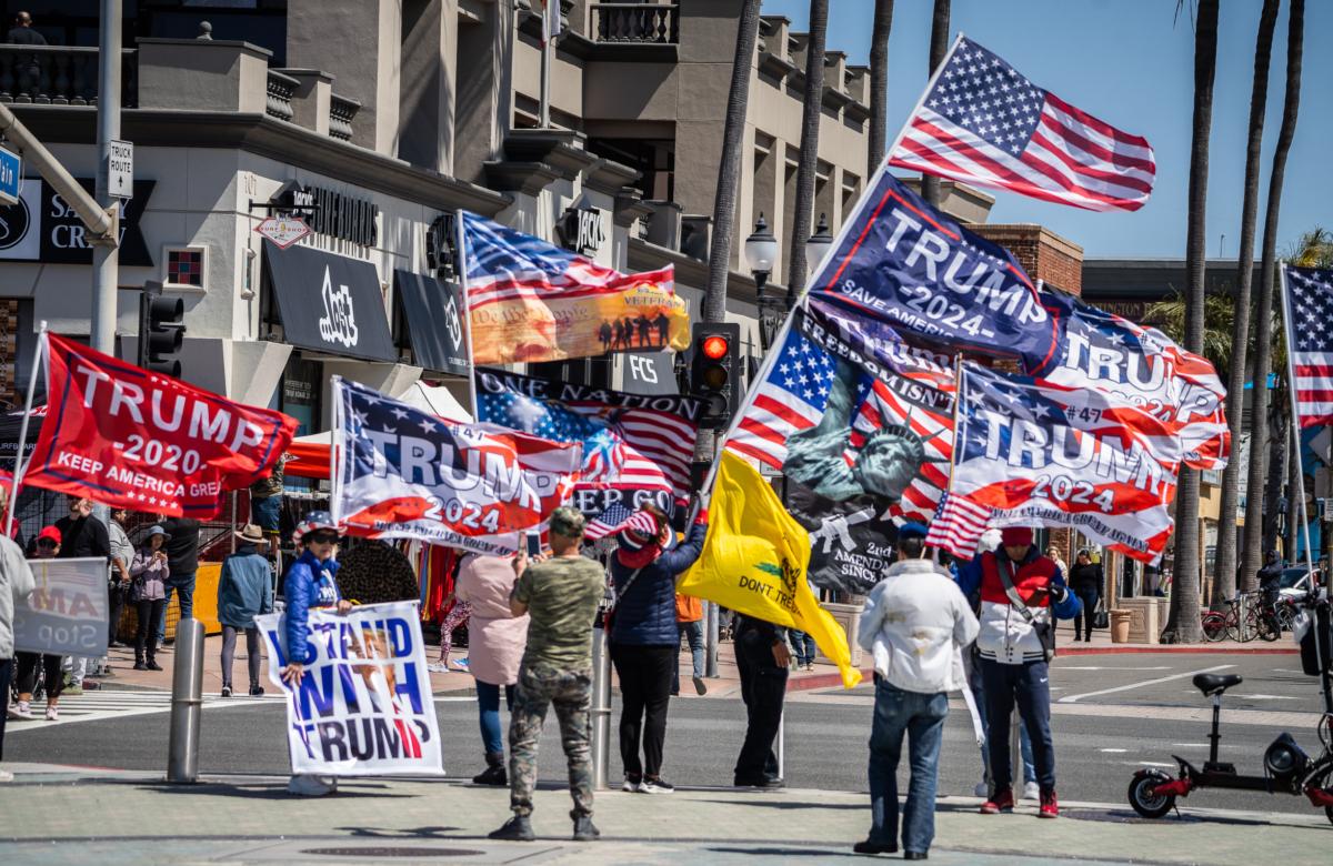 Supporters of former president Donald Trump gather at the Huntington Beach Pier in Huntington Beach, Calif., on April 4, 2023. (John Fredricks/The Epoch Times)