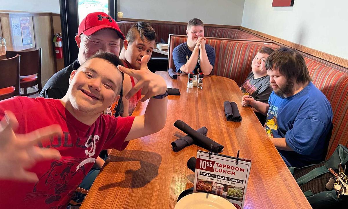  The Pinkerton boys pose for a photo at a restaurant. (Courtesy of <a href="https://www.instagram.com/pinkerton_boys_adventures_/">Shannon Barrett Pinkerton</a>)