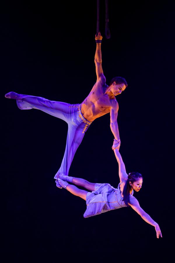  Two gymnasts use straps to swing. (Maja Prgomet/Cirque du Soleil 2023)