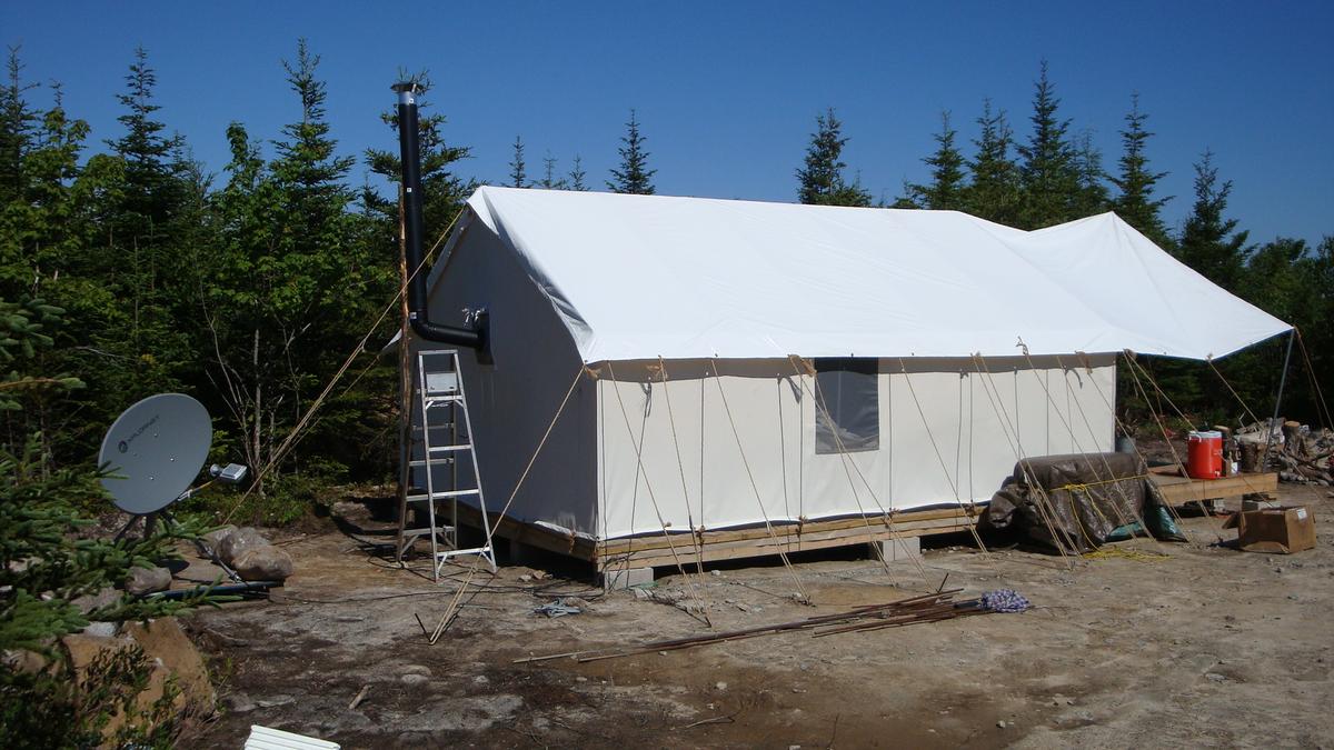 Living in the tent while building their house. (Courtesy of Ron Melchiore)