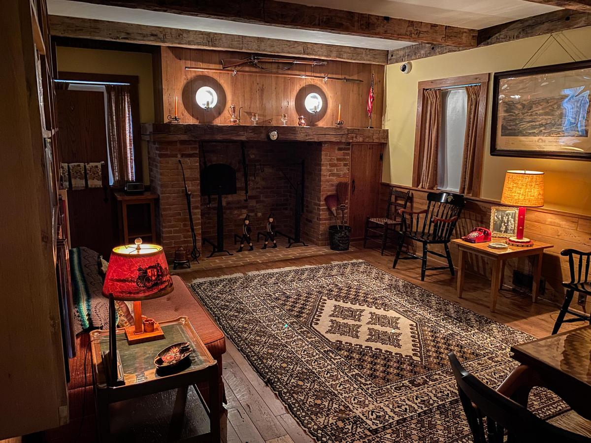 The den is where salvaged materials from the original log cabin were repurposed and reused. On one side is the red phone where he took the call informing him of the U-2 crisis. (Lynn Topel)