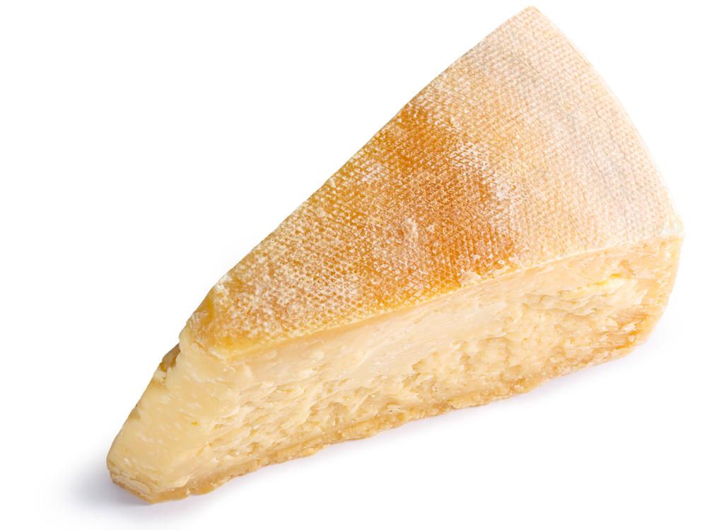 A hunk of a cheese rind is the surprise—and key—ingredient, which provides depth of flavor and body to the broth.<br/>(Hortimages/Shutterstock)