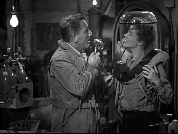  Pat Jamieson (Spencer Tracy) and Jamie Rowan (Katharine Hepburn) test an oxygen mask, in "Without Love." (Metro-Goldwyn-Mayer)