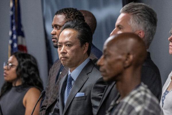  Sacramento County District Attorney Thien Ho stands with supporters and victims of alleged crimes by homeless residents at a press conference announcing that his office is suing the City of Sacramento, Calif., on Sept. 19, 2023. (Hector Amezcua/The Sacramento Bee via AP)