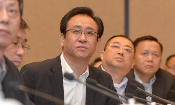 China’s Evergrande Shares Halt Trading After News That Chairman Under Police Surveillance