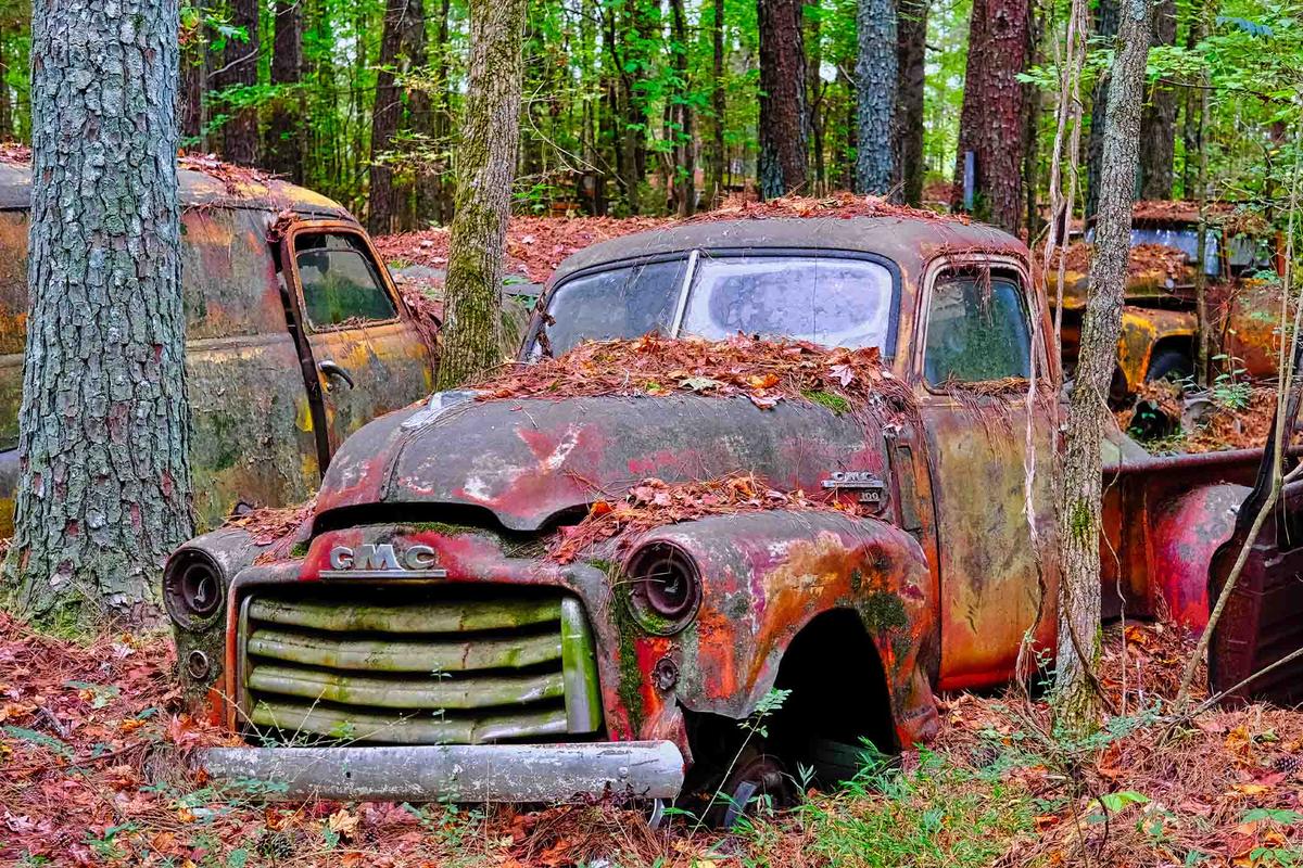 A wrecked GMC pickup sits in disrepair in the junkyard museum called Old Car City, near White, Georgia. (Darryl Brooks/Shutterstock)