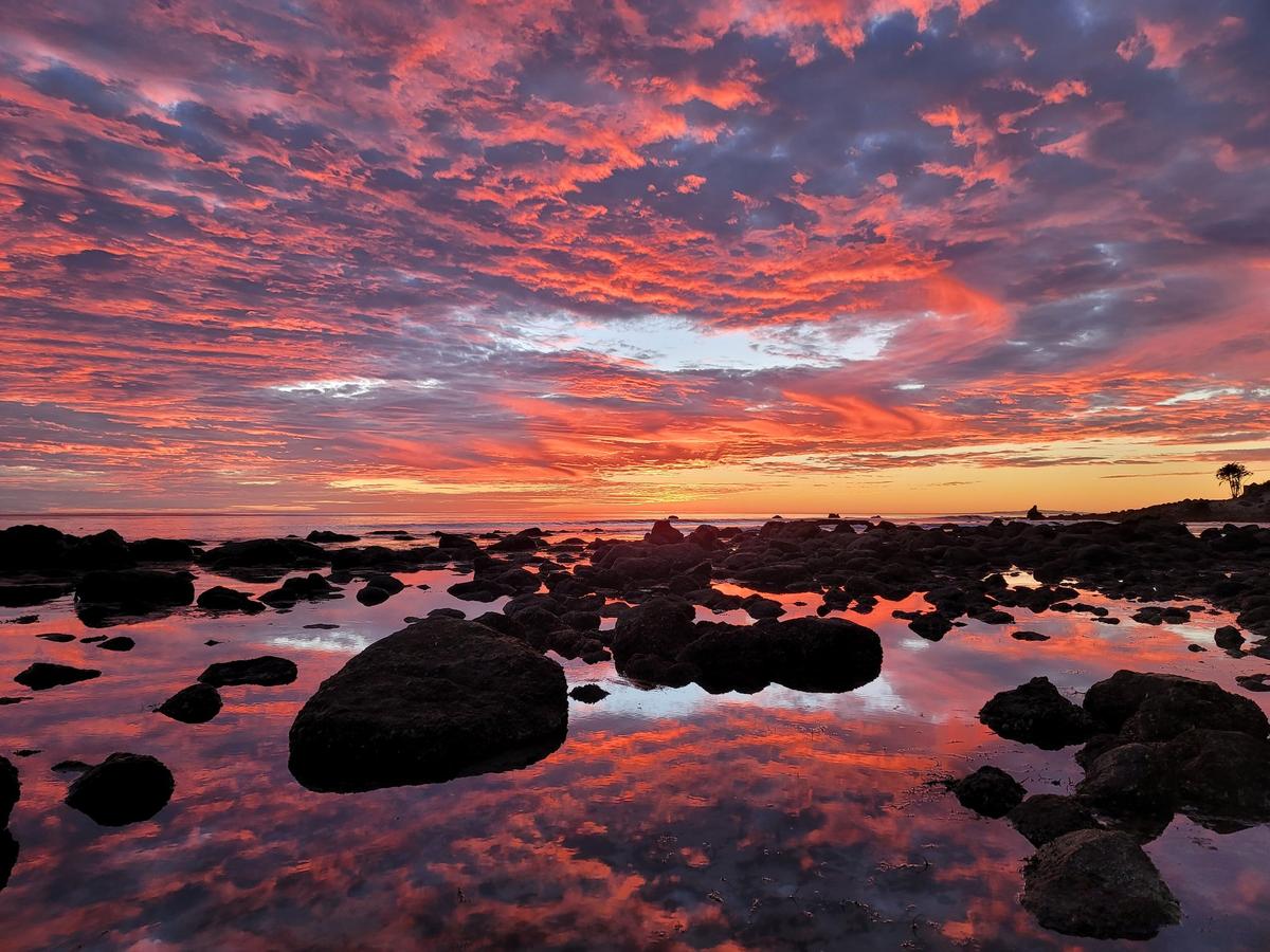 Runner-up of Standard Chartered Young Weather Photographer of the Year was awarded to Siyana Lapinsky, 14, for her prestigious work titled "Reflections Over the Pacific Ocean." Taken near her home in Malibu, California, the image reveals the breathtaking beauty of a pink, orange, and yellow sunset. (Courtesy of Siyana Lapinsky via Weather Photographer of the Year)