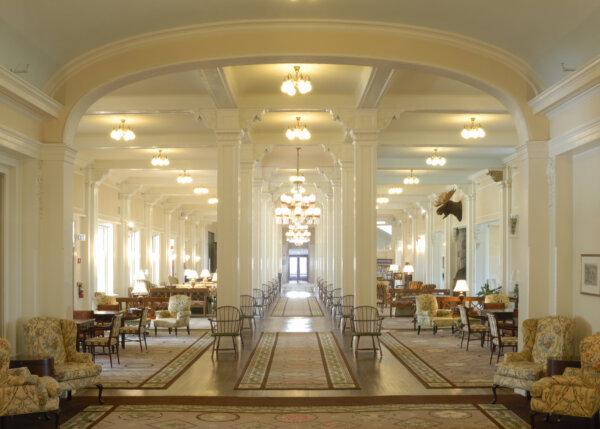 The Great Hall holds a French-revival-style lobby that was restored in 2007 at the cost of $1.2 million. From the hotel’s original ballroom down the classical column-flanked, symmetrical hallway are handcrafted Windsor chairs with embossed “MW” green leather seats. The intricate moldings and corbels convey foliage designs, and the carpets feature designs of some of the region’s indigenous wildflowers, such as bluebells, buttercups, and sandwort. The many brass lighting fixtures and chandeliers in this space are all original. (Courtesy of the Mount Washington Hotel)