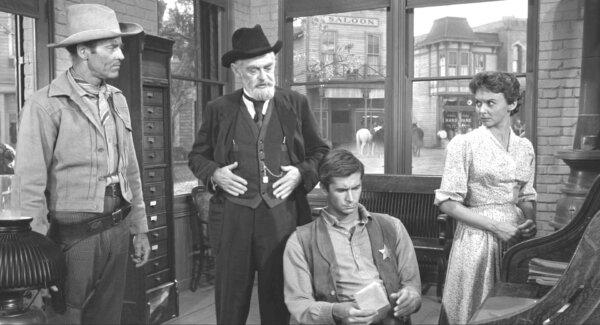  (L–R) Morgan Hickman (Henry Fonda), Dr. Joseph McCord (John McIntire), Ben Owens (Anthony Perkins), and Millie Parker (Mary Webster), in “The Tin Star.” (Paramount Pictures)