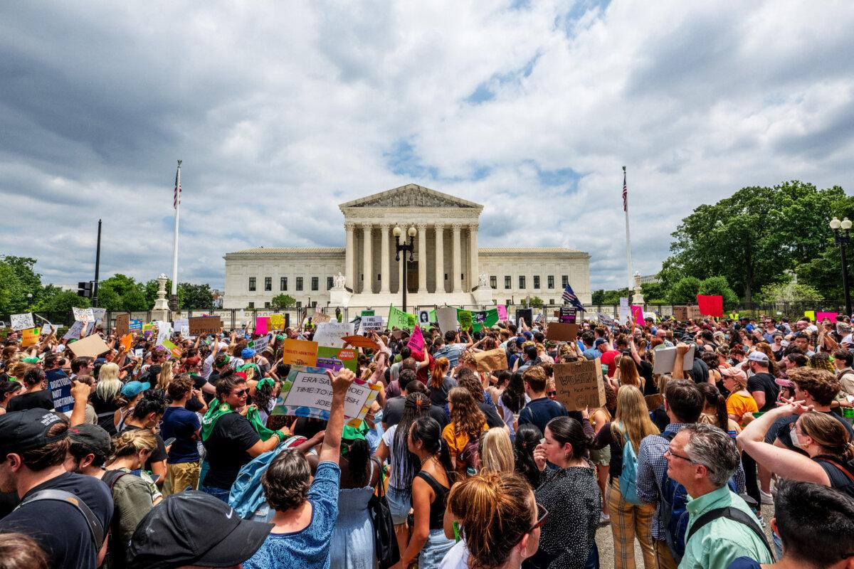 People protest in response to the Dobbs v. Jackson Women's Health Organization ruling in front of the Supreme Court in Washington, on June 24, 2022. (Brandon Bell/Getty Images)