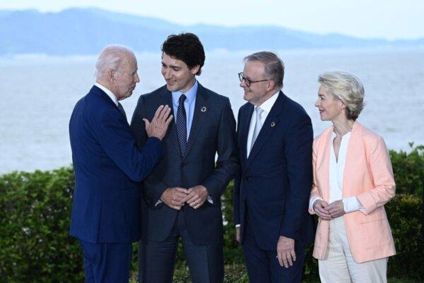 (L to R) U.S. President Joe Biden speaks with Canada's Prime Minister Justin Trudeau, Australia's Prime Minister Anthony Albanese, and European Commission President Ursula von der Leyen during the G7 Leaders' Summit in Hiroshima on May 20, 2023. (Brendan Smialowski/Pool/AFP via Getty Images)