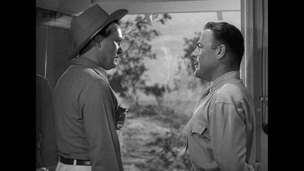 Contracting boss Shad McClosky (Albert Dekker, L) and Marine Maj. Geoffrey Caton (Brian Donlevy), in “Wake Island.” (Paramount Pictures)