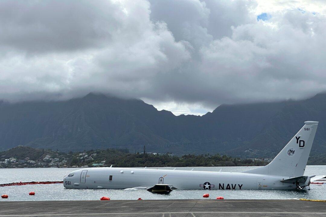 US Navy Removes Fuel From Plane That Overshot Hawaii Runway and Is Now Resting on Reef and Sand