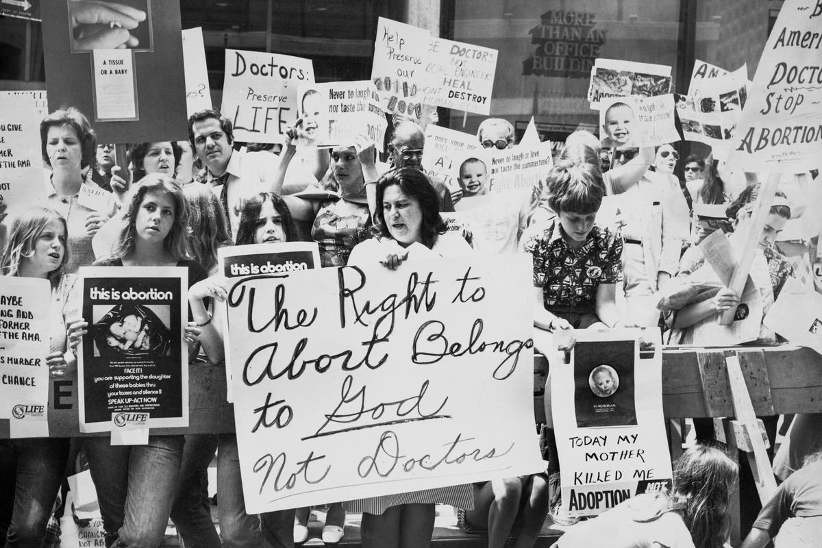 Pro-life activists gather to protest against abortion outside a hotel where the annual convention of American Medical Association is taking place in New York City, circa 1975. (Peter Keegan/Authenticated News/Archive Photos/Getty Images)