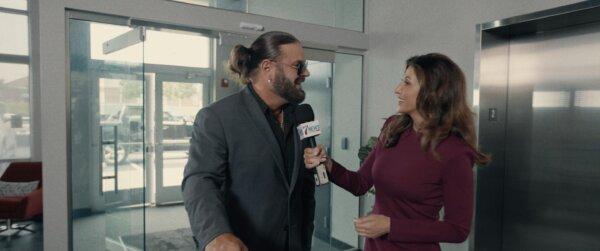 Mason Stone (James Storm) is interviewed by Julie Vincent (Jaclyn Stapp), in “Jingle Smells” (ACLJ Films)