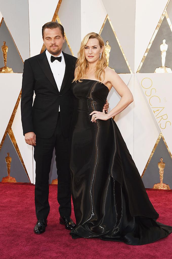 Actor Leonardo DiCaprio dons a classic Armani suit with a peak lapel, with co-star Kate Winslet by his side, at the Academy Awards red carpet in Hollywood, Calif., on Feb. 28, 2016. (Jason Merritt/Getty Images)