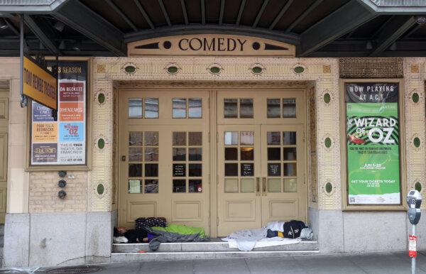 Homeless people sleep in the doorway of the American Conservatory Theater in San Francisco on May 11, 2023. (Justin Sullivan/Getty Images)