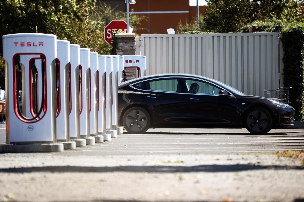 A Tesla sits parked at a Tesla Supercharger in Petaluma, Calif., on Sept. 23, 2020. California Gov. Gavin Newsom signed an executive order banning sales of internal combustion engines in the state after 2035. (Justin Sullivan/Getty Images)