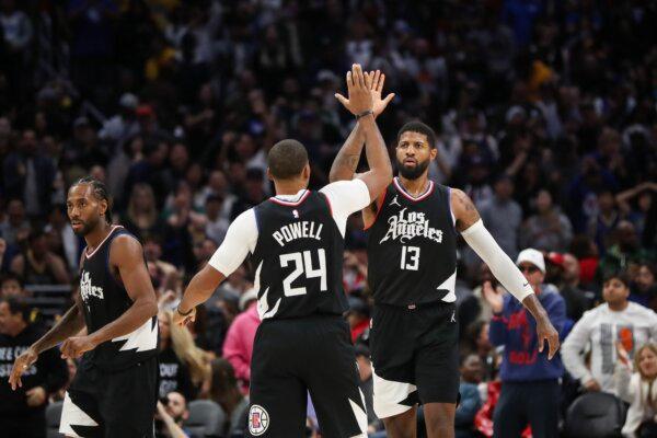 Paul George (13) of the LA Clippers reacts to his shot in the end of the fourth quarter against the Golden State Warriors with Norman Powell (24) in Los Angeles on Dec. 2, 2023. (Meg Oliphant/Getty Images)
