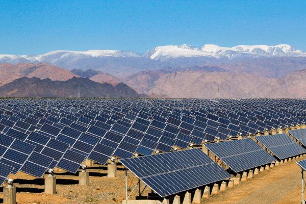 Large solar panels are seen in a solar power plant in Hami, northwest China's Xinjiang region on May 8, 2013. (STR/AFP via Getty Images)