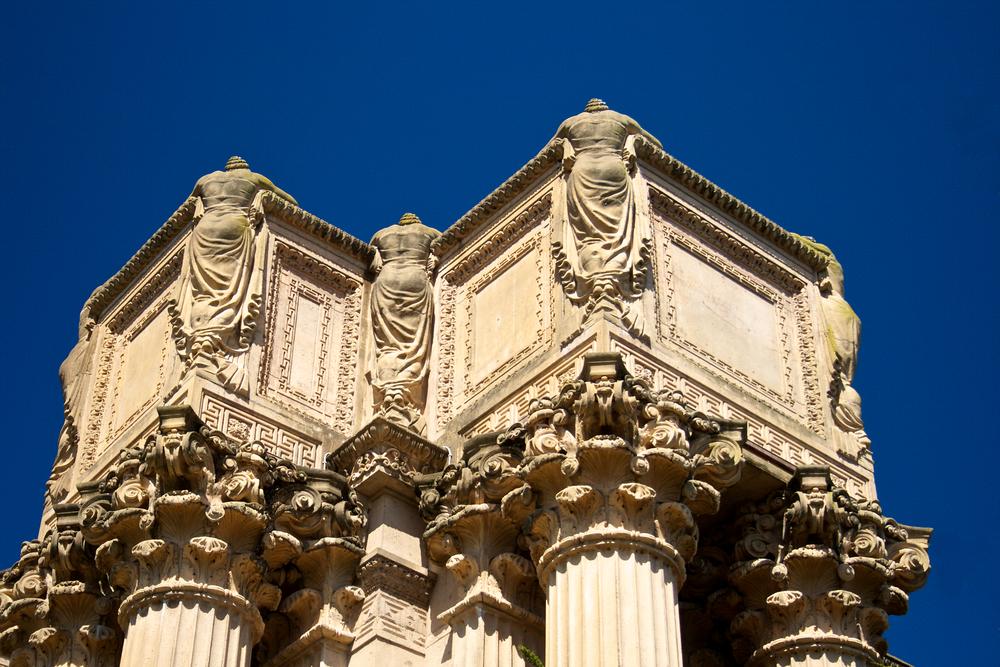 The tops of the Corinthian columns along the walkways are planters, and on each corner are statues of the weeping women facing away from the viewer to symbolize the melancholy of life without art. Initially, the planters on top of the columns were intended to have vines planted in them that would hang over the women to provide more modesty.(Courtesy of Palace of Fine Arts)