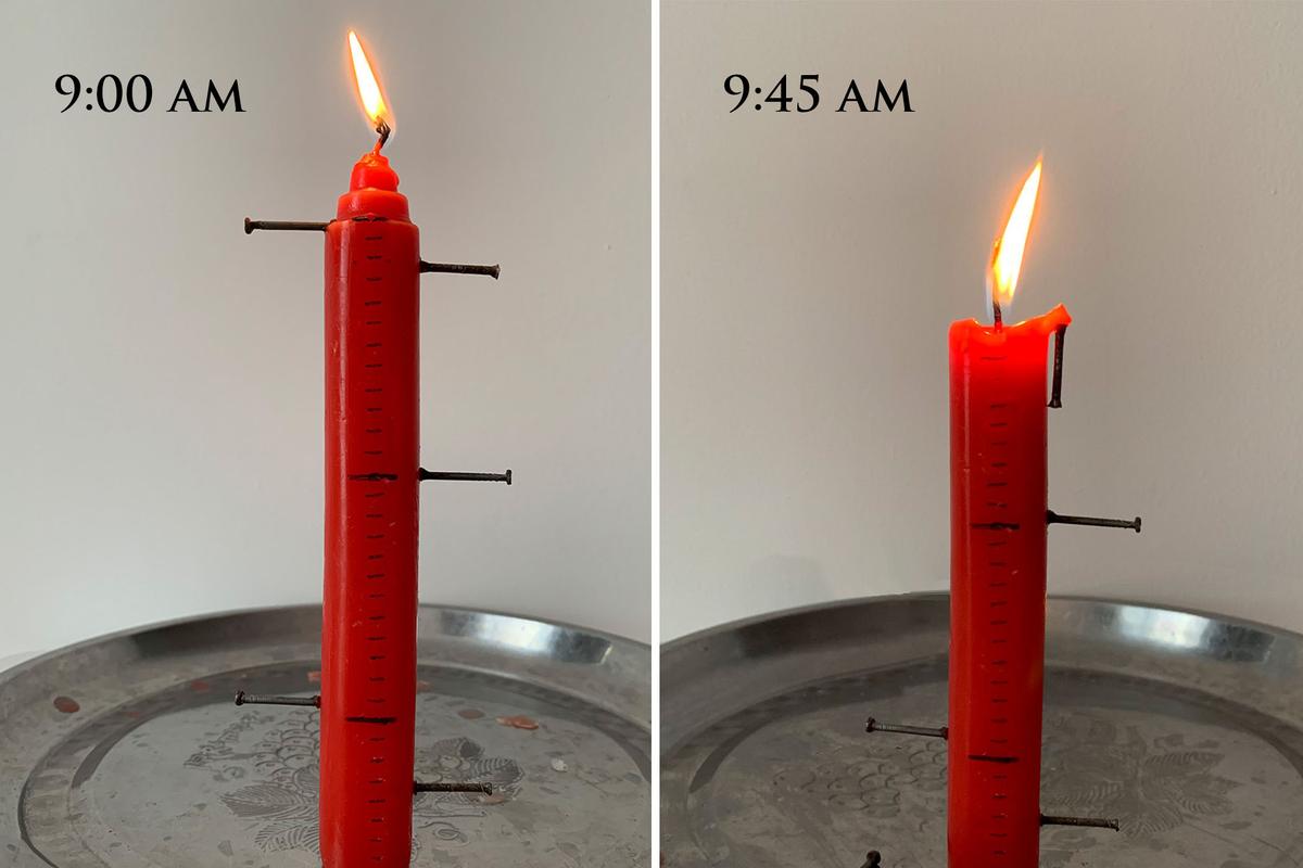 Live demonstration of a candle clock in the morning, with several "alarms" set throughout the day. (The Epoch Times)
