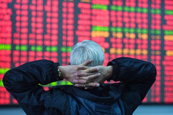 An investor looks at a screen showing stock market movements at a securities company in Hangzhou, in eastern China's Zhejiang Province, on Feb. 8, 2024. (STR/AFP via Getty Images)