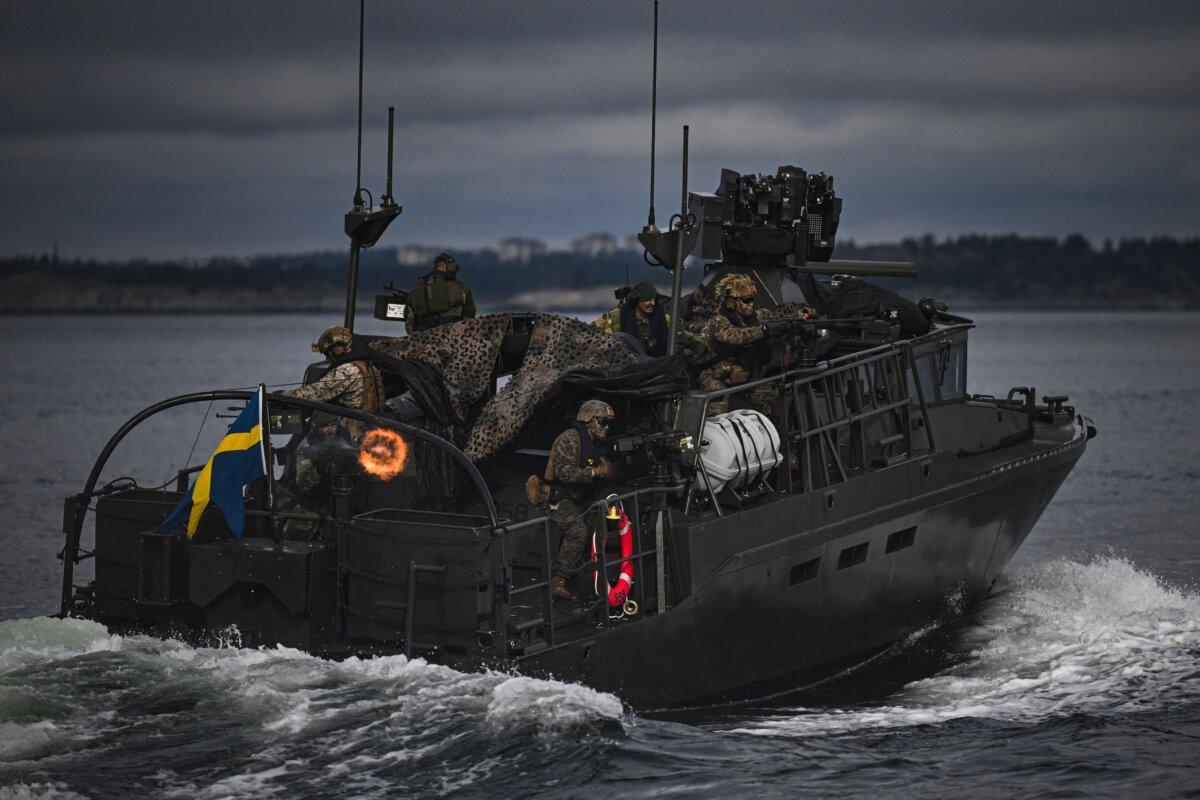 Soldiers from the Swedish Amphibious Corps and the US Marine Corps ride on the CB90-class fast assault craft nearMällsten island in the Stockholm Archipelago, on September 13, 2023.  (Jonathan Nackstrand/AFP via Getty Images)