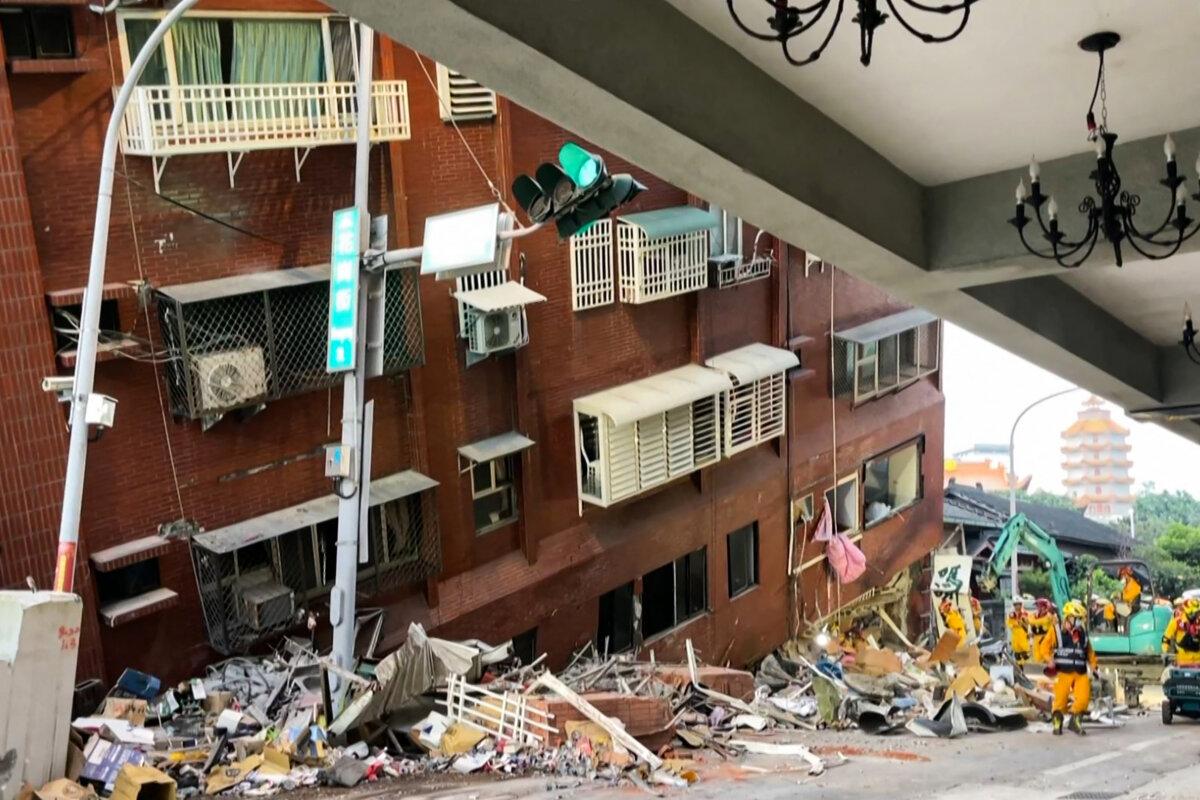 Rescue workers searching for survivors at the damaged Uranus Building in Hualien, after a major earthquake hit Taiwan's east, in a frame grab from AFPTV video taken on April 3, 2024.  (STR/AFPTV/AFP via Getty Images)