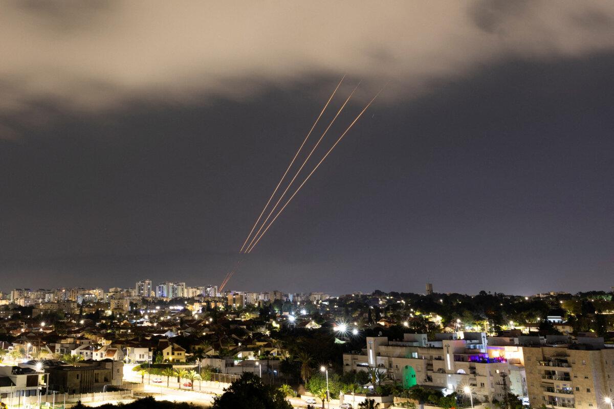 An anti-missile system operates after Iran launched drones and missiles towards Israel, as seen from Ashkelon, Israel, on April 14, 2024. (Amir Cohen/Reuters)