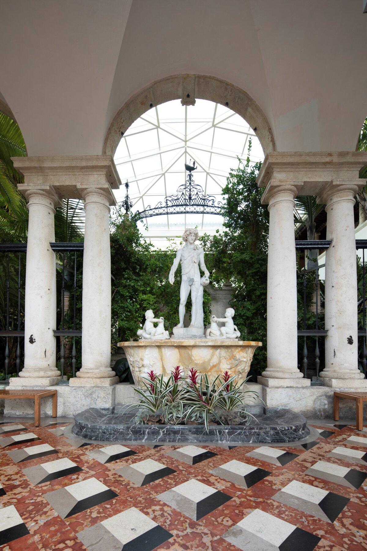 The courtyard, with its symmetrical marble columns bolstering a centerpiece arch, was created to serve as a courtyard garden. The statuary sits on a coral limestone floor, which was quarried on-site during the estate’s construction. Although the space was originally open, a glass canopy was installed in 1983 and upgraded in 2012 to preserve the items on display. (Robin Hill/Vizcaya Museum and Gardens)