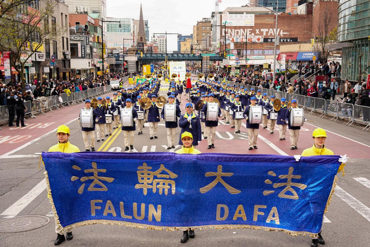Falun Gong practitioners attend a parade to call for an end to the persecution in China of their faith, in the Flushing neighborhood of Queens, New York, on April 21, 2024. (Larry Dye/The Epoch Times)