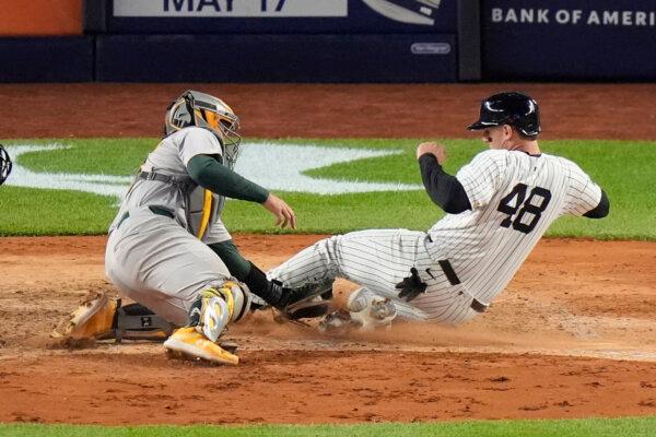 A's catcher Shea Langeliers tags out the Yankees' Anthony Rizzo on a play at the plate in New York on April 24, 2024. (Frank Franklin II/AP Photo)