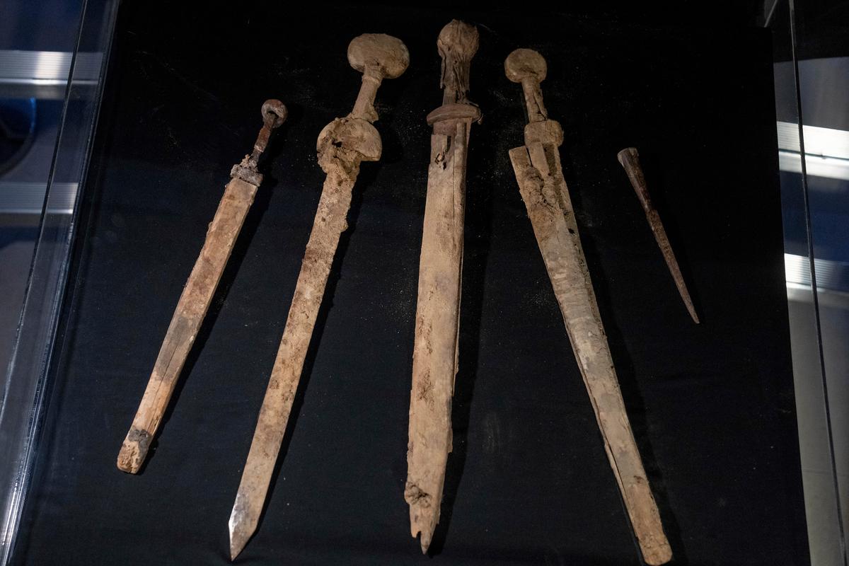 Four Roman-era swords and a javelin head found during a recent excavation in a cave near the Dead Sea in Israel, Wednesday, Sep. 6, 2023. (Ohad Zwigenberg/AP Photo)